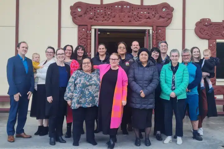 The NZCCSS team in front of a Marae