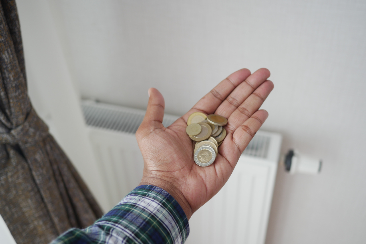 coins on hand against Radiator To Save On Energy Bill.