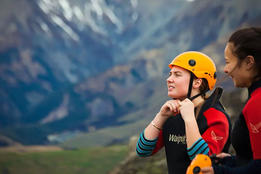 Rangatahi putting on helmets at Cave Stream Scenic Reserve (2016)