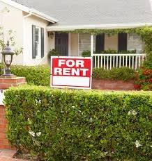 Cottage with For Rent sign